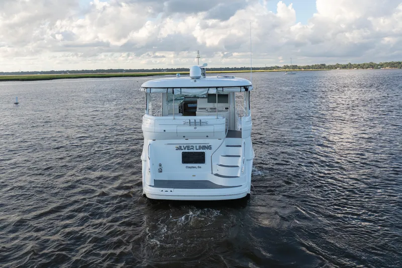 Slide: The Image of 2007 Sea Ray 40 Motor Yacht on open water under cloudy sky. - 21