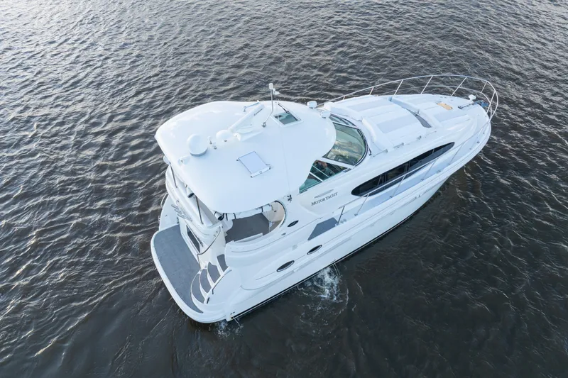Slide: The Image of 2007 Sea Ray 40 Motor Yacht cruising on open water, aerial view. - 22