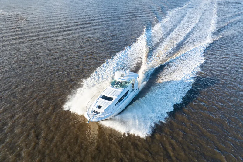 Slide: The Image of 2007 Sea Ray 40 Motor Yacht cruising on open water, aerial view. - 27