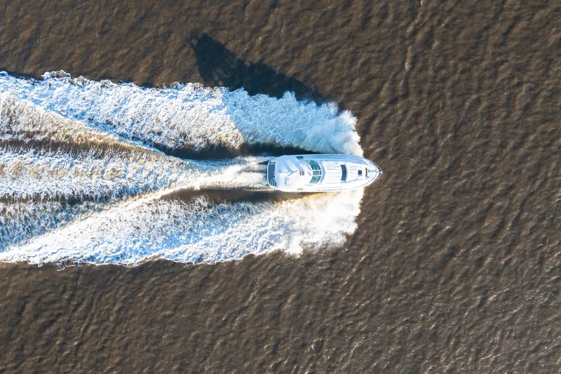 Slide: The Image of Aerial view of 2007 Sea Ray 40 Motor Yacht cruising on water. - 30