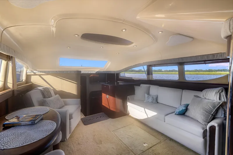 Slide: The Image of Luxurious interior of 2007 Sea Ray 40 Motor Yacht with elegant seating and scenic windows. - 32