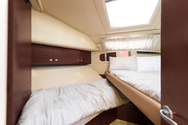 Slide: The Image of Luxurious cabin interior of 2007 Sea Ray 40 Motor Yacht with cozy bedding. - 39