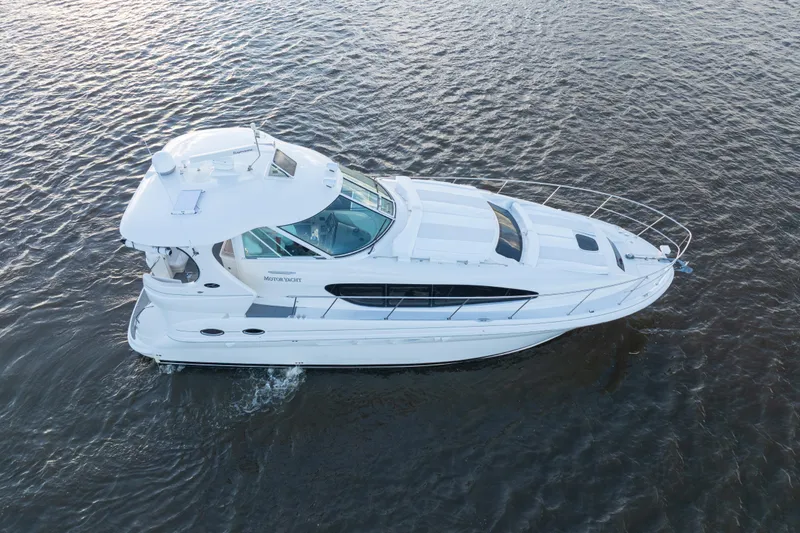 Slide: The Image of 2007 Sea Ray 40 Motor Yacht cruising on open water, aerial view. - 4