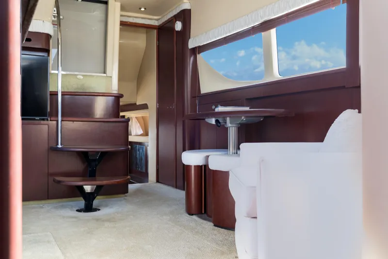 Slide: The Image of Interior of 2007 Sea Ray 40 Motor Yacht with elegant wood finishes and seating area. - 40