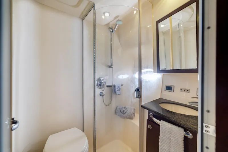 Slide: The Image of Luxurious bathroom in a 2007 Sea Ray 40 Motor Yacht, featuring a shower and vanity. - 41