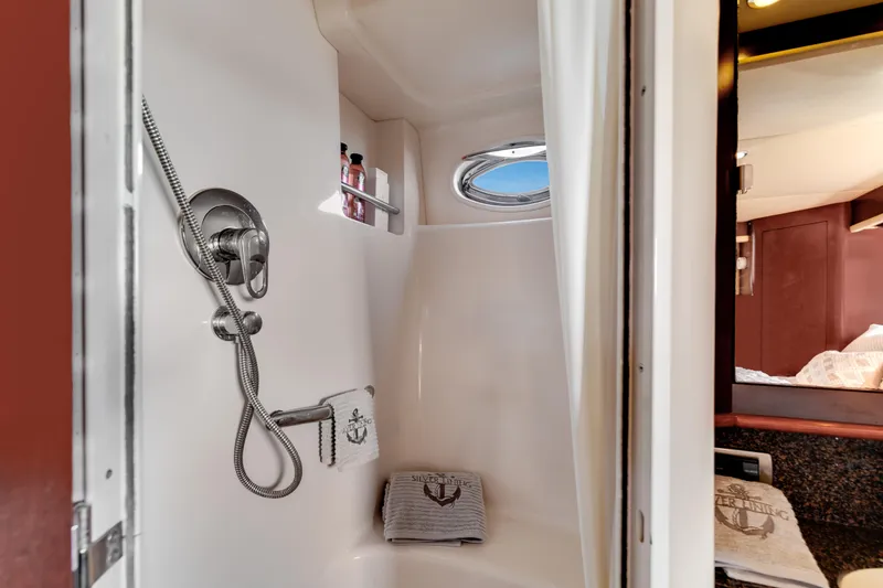 Slide: The Image of Shower area in 2007 Sea Ray 40 Motor Yacht with porthole and towels. - 46