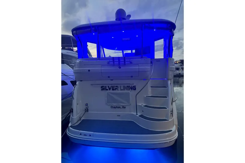 Slide: The Image of 2007 Sea Ray 40 Motor Yacht with blue LED lights at night, docked in Clayton, GA. - 5