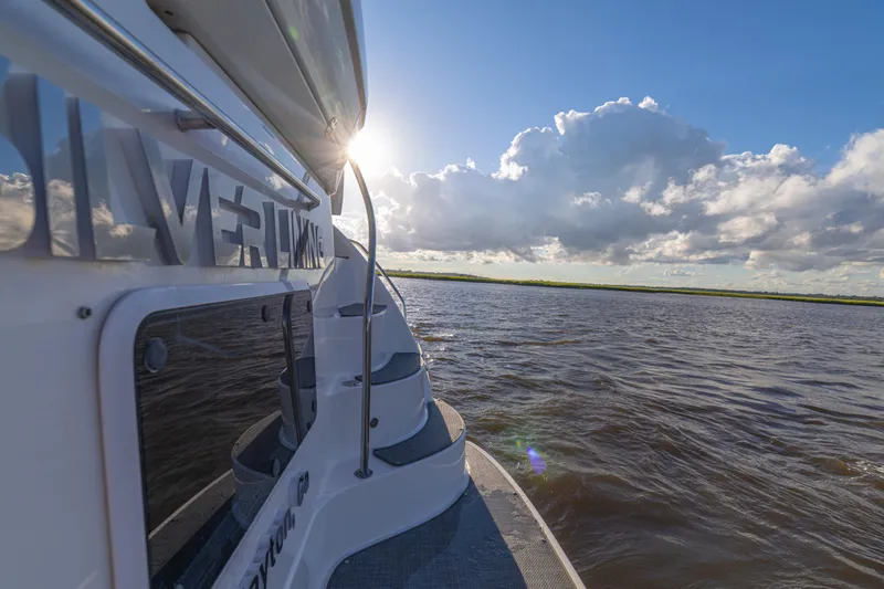 Slide: The Image of 2007 Sea Ray 40 Motor Yacht cruising on a sunny day with scenic water view. - 51