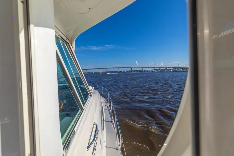 Slide: The Image of 2007 Sea Ray 40 Motor Yacht cruising on a sunny day with bridge view. - 52
