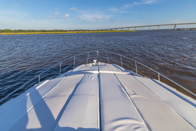 Slide: The Image of 2007 Sea Ray 40 Motor Yacht cruising on a sunny day with bridge in background. - 54