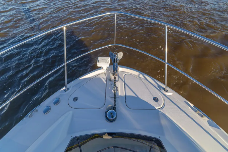 Slide: The Image of Bow view of 2007 Sea Ray 40 Motor Yacht on water. - 55