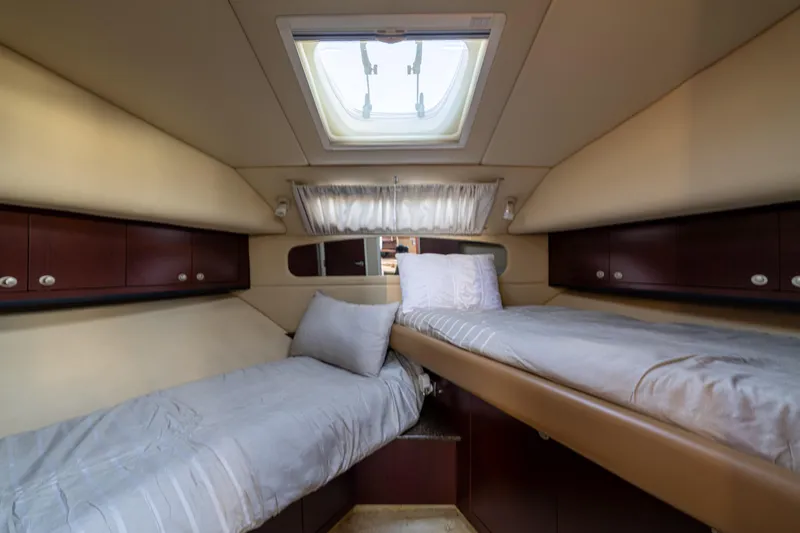 Slide: The Image of Luxurious 2007 Sea Ray 40 Motor Yacht cabin with twin beds and skylight. - 64