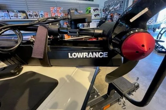 Slide: The Image of 2022 Tracker Pro Team 175 TXW with Lowrance equipment in a showroom. - 11