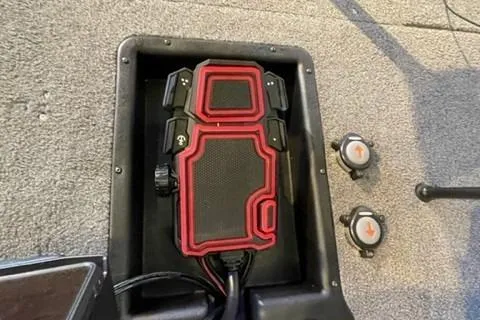 Slide: The Image of Red and black device on 2022 Tracker Pro Team 175 TXW boat floor. - 13
