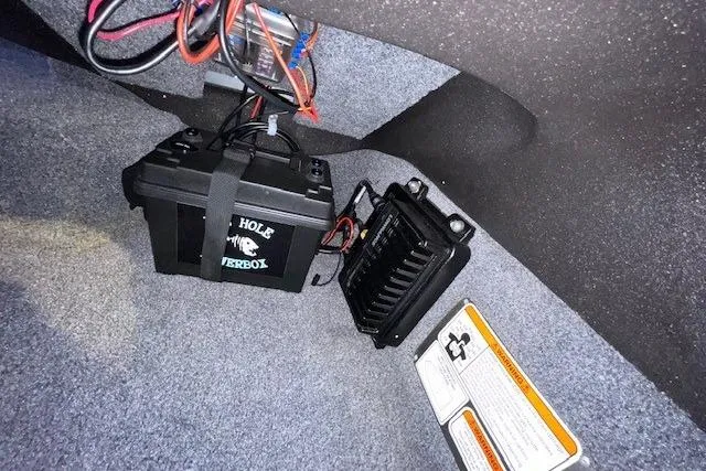 Slide: The Image of 2022 Tracker Pro Team 175 TXW boat interior with battery and wiring components. - 15