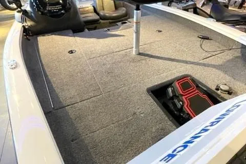 Slide: The Image of 2022 Tracker Pro Team 175 TXW boat interior with carpeted deck and storage compartments. - 17
