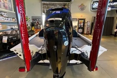 Slide: The Image of 2022 Tracker Pro Team 175 TXW boat with Mercury engine in showroom. - 2