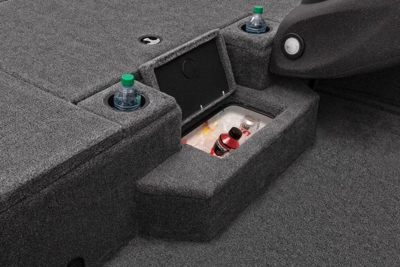 Slide: The Image of 2022 Tracker Pro Team 175 TXW boat interior with storage compartment and cup holders. - 24