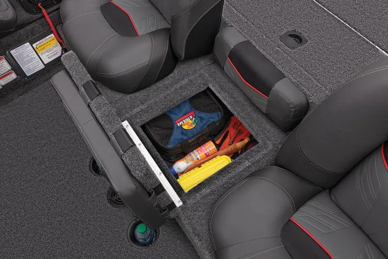 Slide: The Image of 2022 Tracker Pro Team 175 TXW boat interior storage compartment with gear and accessories. - 31