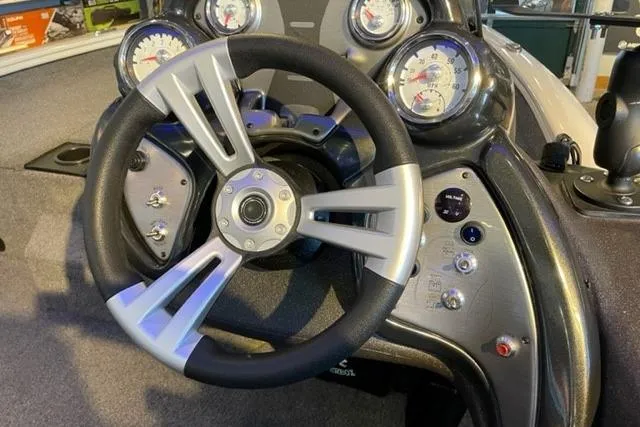 Slide: The Image of Steering wheel and dashboard of 2022 Tracker Pro Team 175 TXW boat. - 4