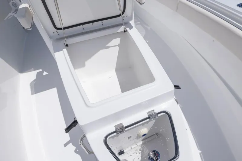 Slide: The Image of 2026 Sea Hunt Gamefish 27 Coffin Box interior, open storage compartment view. - 10