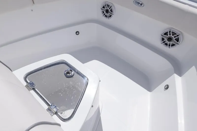 Slide: The Image of 2026 Sea Hunt Gamefish 27 Coffin Box interior with speakers and storage compartment. - 11