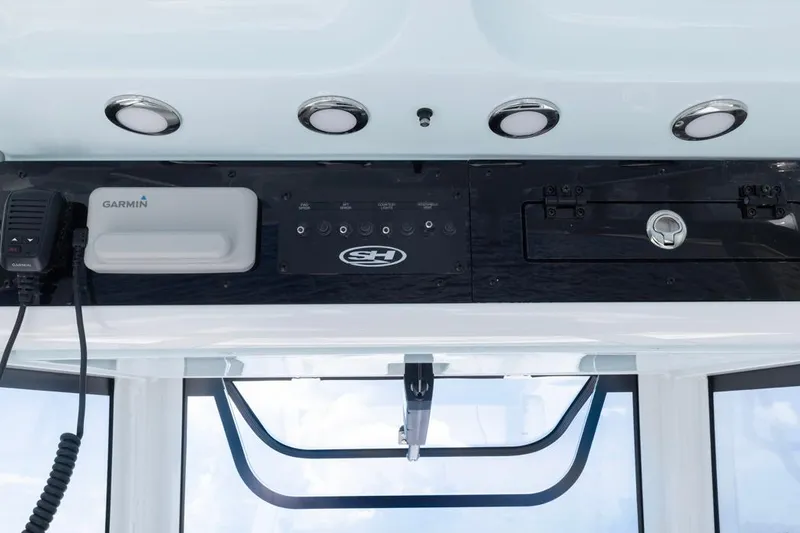 Slide: The Image of 2026 Sea Hunt Gamefish 27 Coffin Box dashboard with Garmin equipment and controls. - 16