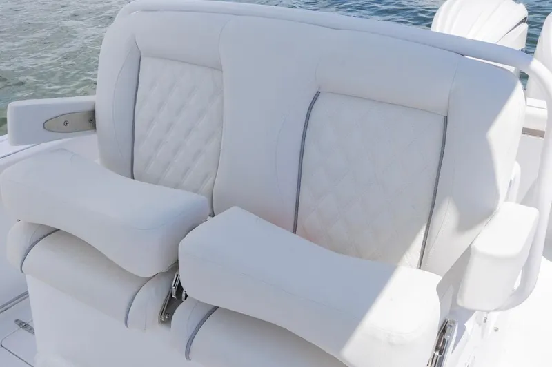 Slide: The Image of Luxury seating on 2026 Sea Hunt Gamefish 27 Coffin Box boat, featuring white cushioned design. - 17