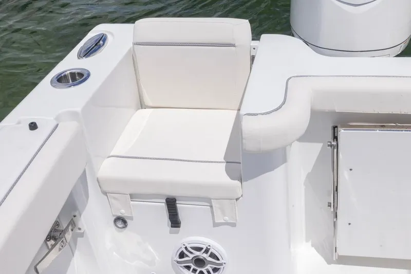 Slide: The Image of 2026 Sea Hunt Gamefish 27 Coffin Box boat seat with cup holder and speaker. - 22