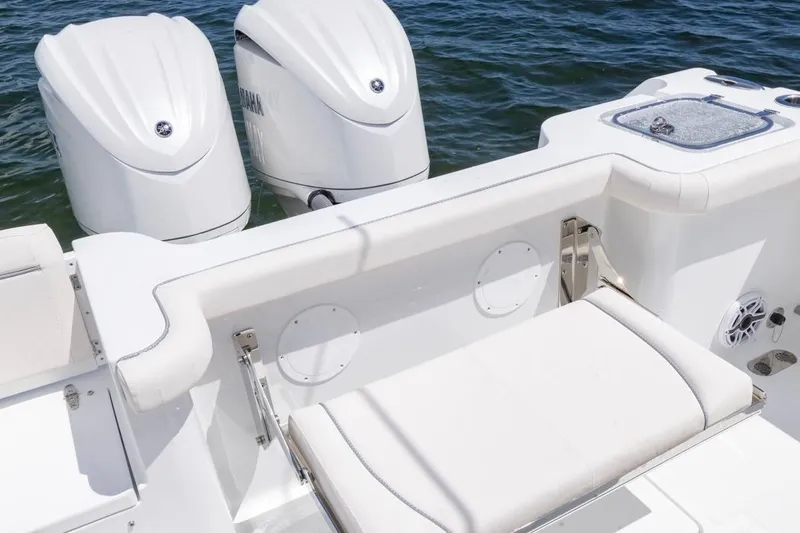 Slide: The Image of 2026 Sea Hunt Gamefish 27 Coffin Box with dual outboard motors on water. - 26