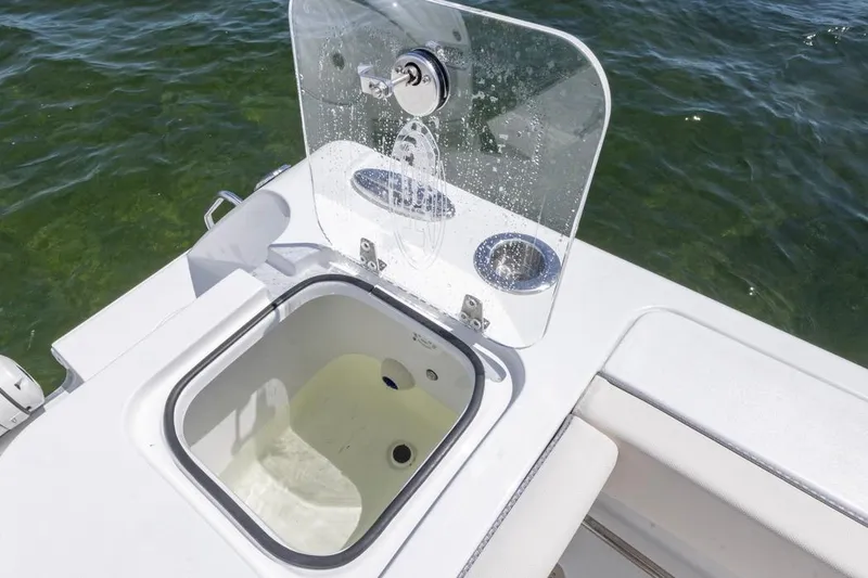 Slide: The Image of Open storage compartment on 2026 Sea Hunt Gamefish 27 Coffin Box boat. - 27