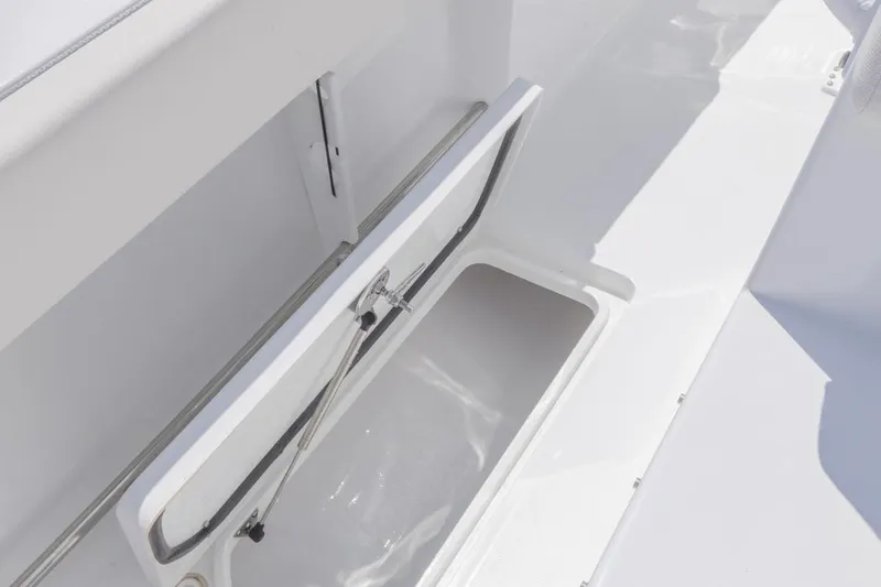 Slide: The Image of 2026 Sea Hunt Gamefish 27 Coffin Box open, showcasing interior storage space. - 30