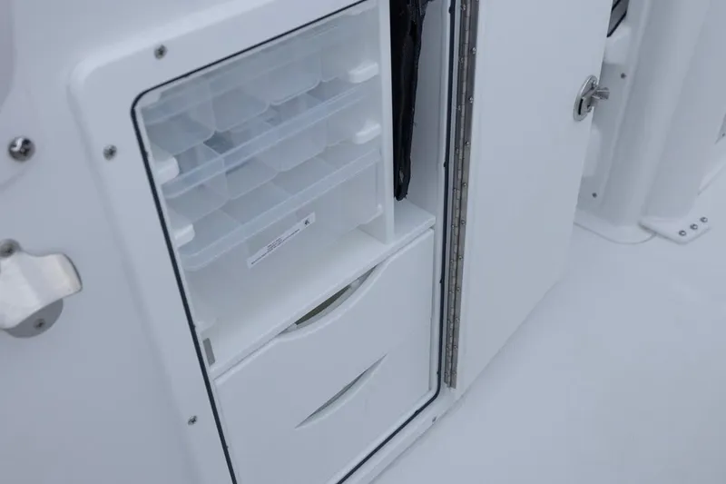 Slide: The Image of 2026 Sea Hunt Gamefish 27 Coffin Box storage compartment with organized trays and drawers. - 33