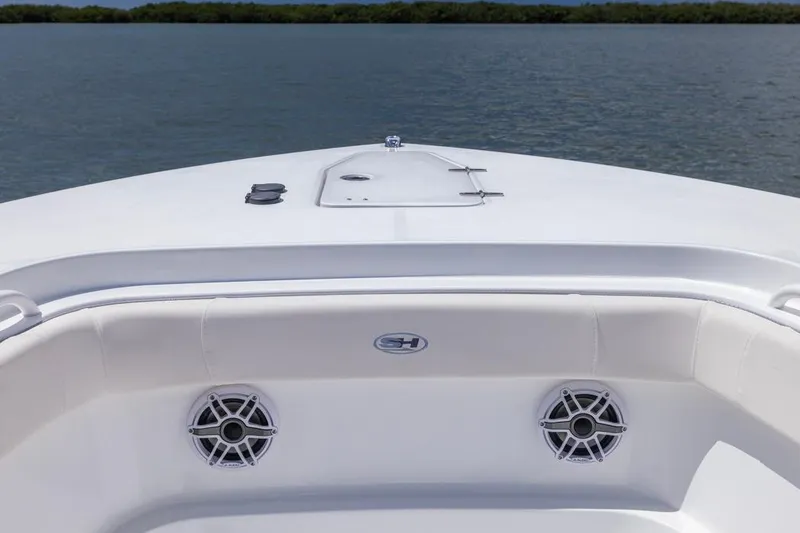 Slide: The Image of 2026 Sea Hunt Gamefish 27 Coffin Box boat, white deck, speakers, calm water background. - 6