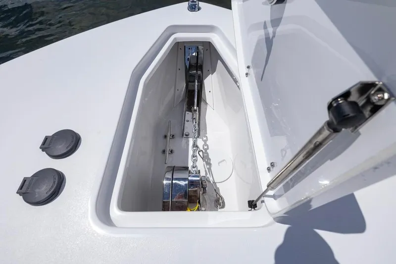 Slide: The Image of 2026 Sea Hunt Gamefish 27 Coffin Box anchor storage compartment with open lid. - 7