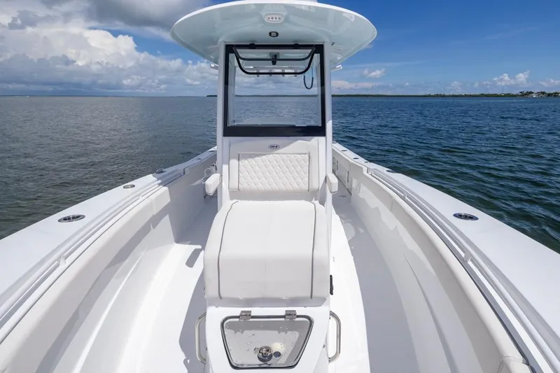 Slide: The Image of 2026 Sea Hunt Gamefish 27 Coffin Box boat on open water, showcasing sleek design. - 9