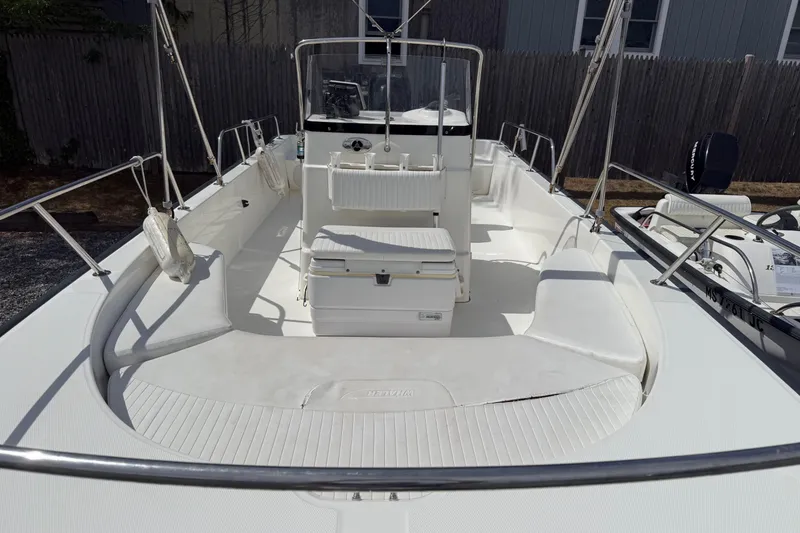 Slide: The Image of 2007 Boston Whaler 190 Montauk boat interior with seating and steering console. - 4