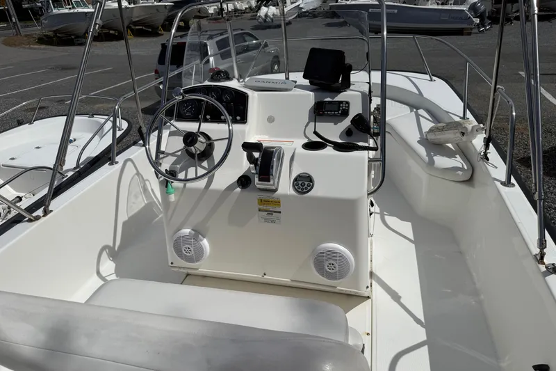Slide: The Image of 2007 Boston Whaler 190 Montauk boat interior with steering console and seating. - 5