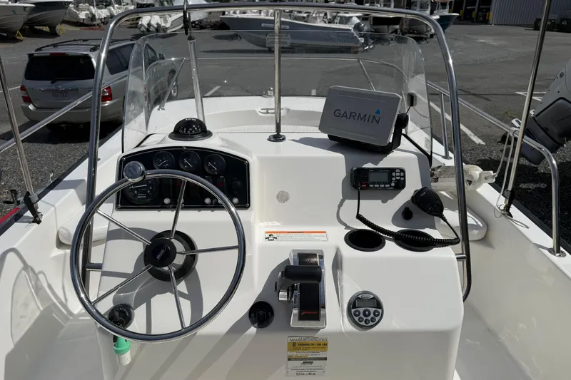 Slide: The Image of 2007 Boston Whaler 190 Montauk boat dashboard with Garmin GPS and marine radio. - 6