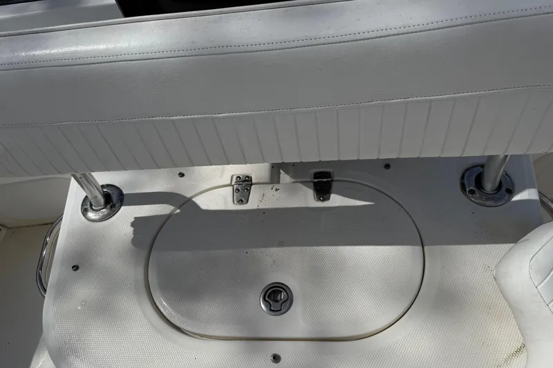 Slide: The Image of 2007 Boston Whaler 190 Montauk boat seat and storage compartment detail. - 9