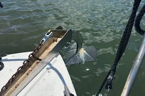 Slide: The Image of 1979 Sun Harbor Sundeck Trawler anchor and chain in water. - 3