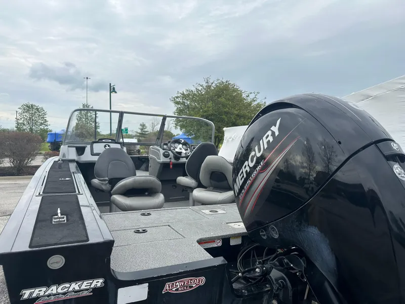 Slide: The Image of 2019 Tracker Targa V-18 WT boat with Mercury engine, parked outdoors. - 3