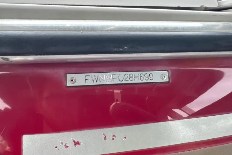 Slide: The Image of 1999 Four Winns 220 Horizon boat with visible hull identification number. - 10