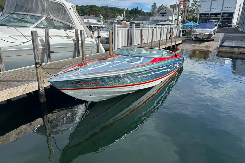 The Image of 2008 Formula 292 FASTech speedboat docked at marina, reflecting on calm water. - 0