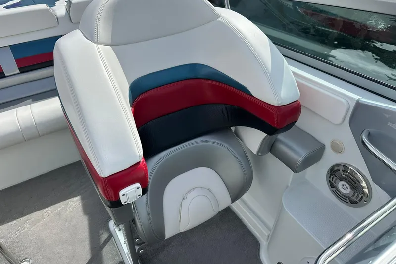 Slide: The Image of 2008 Formula 292 FASTech boat interior with colorful seating and speaker system. - 13