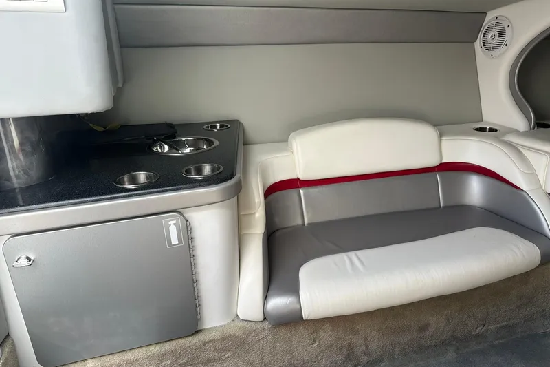 Slide: The Image of Interior of a 2008 Formula 292 FASTech boat, featuring seating and a compact kitchenette. - 15