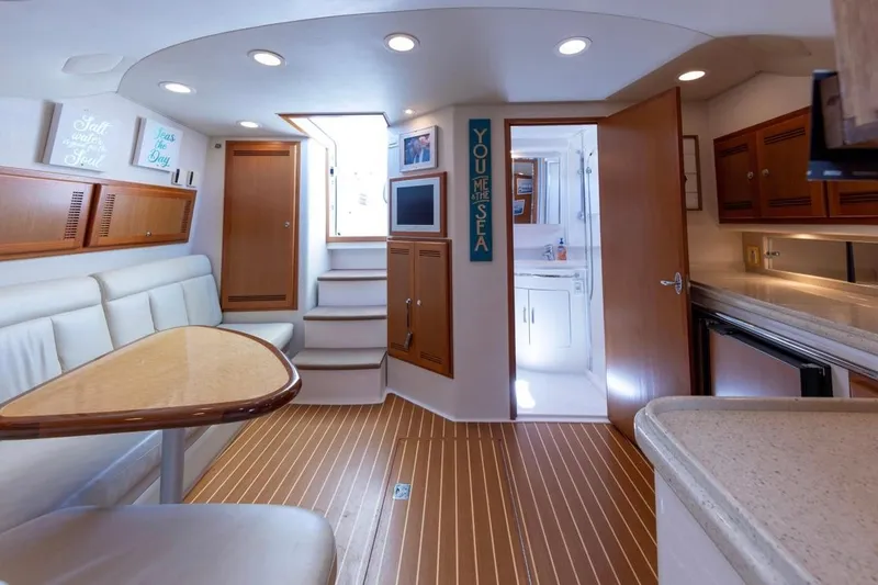 Slide: The Image of Helm of 2005 Cabo 40 Express boat with Garmin navigation system and controls. - 15