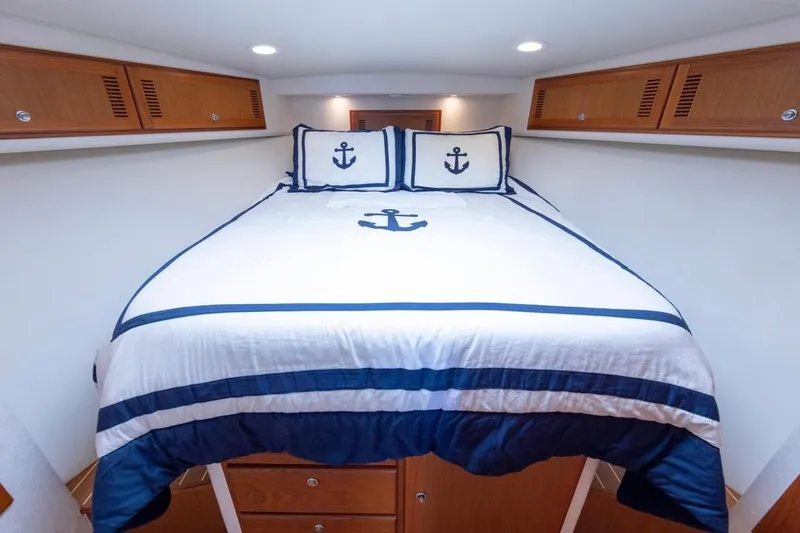 Slide: The Image of Luxurious 2005 Cabo 40 Express yacht interior with cozy seating and modern amenities. - 20