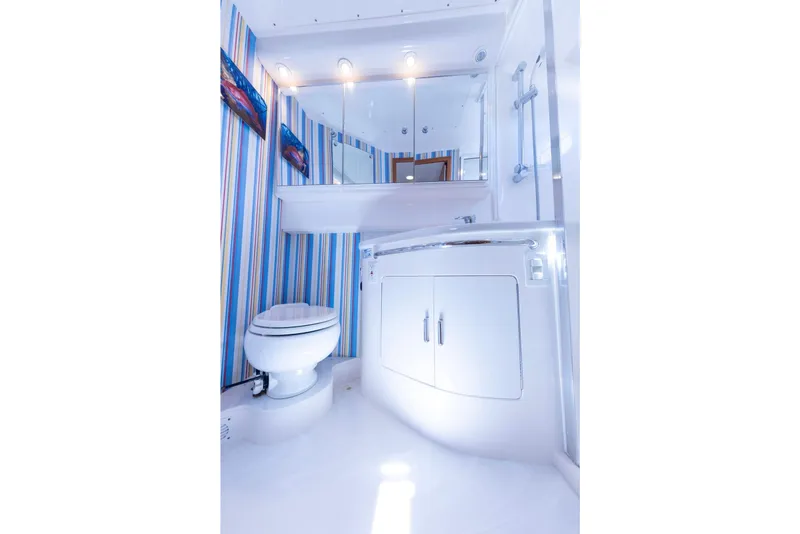 Slide: The Image of Luxurious interior of 2005 Cabo 40 Express yacht with elegant seating and decor. - 21