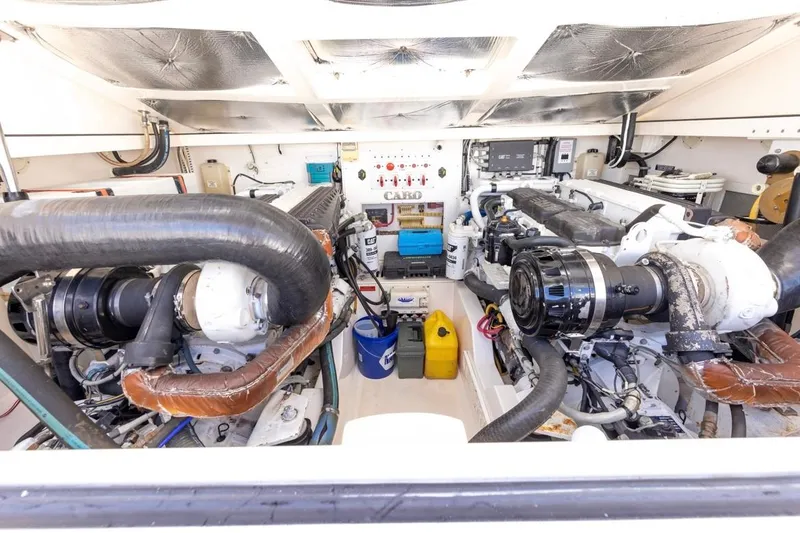 Slide: The Image of Interior of 2005 Cabo 40 Express yacht with modern kitchen and seating area. - 22